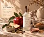 Apple + Cardamom Linen & Room Spray by Inner Light Creative styled with red apple and cardamom pods in warm natural light