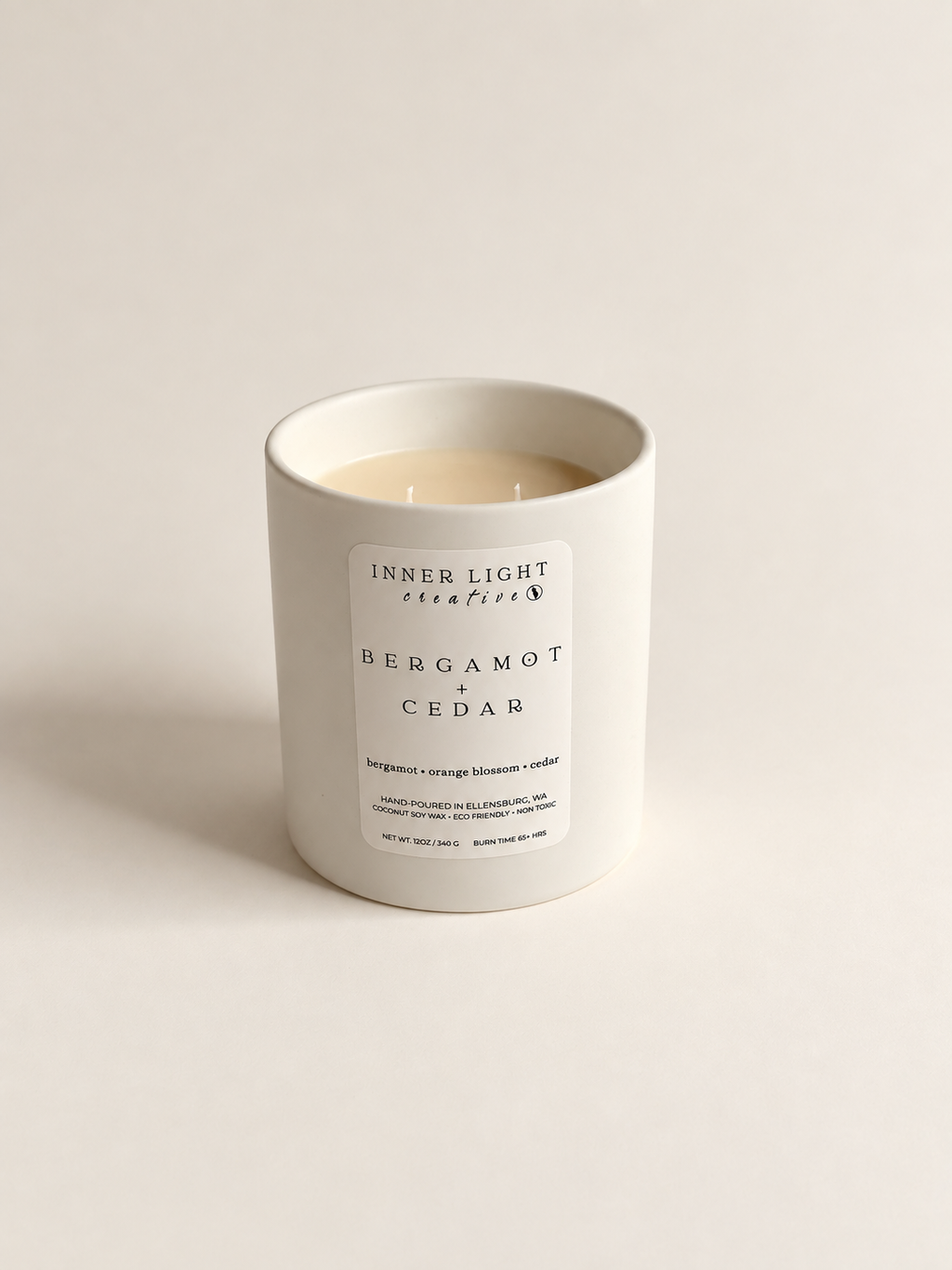 Bergamot + Cedar coconut soy candle styled in soft natural light