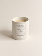 Bergamot + Cedar coconut soy candle styled in soft natural light
