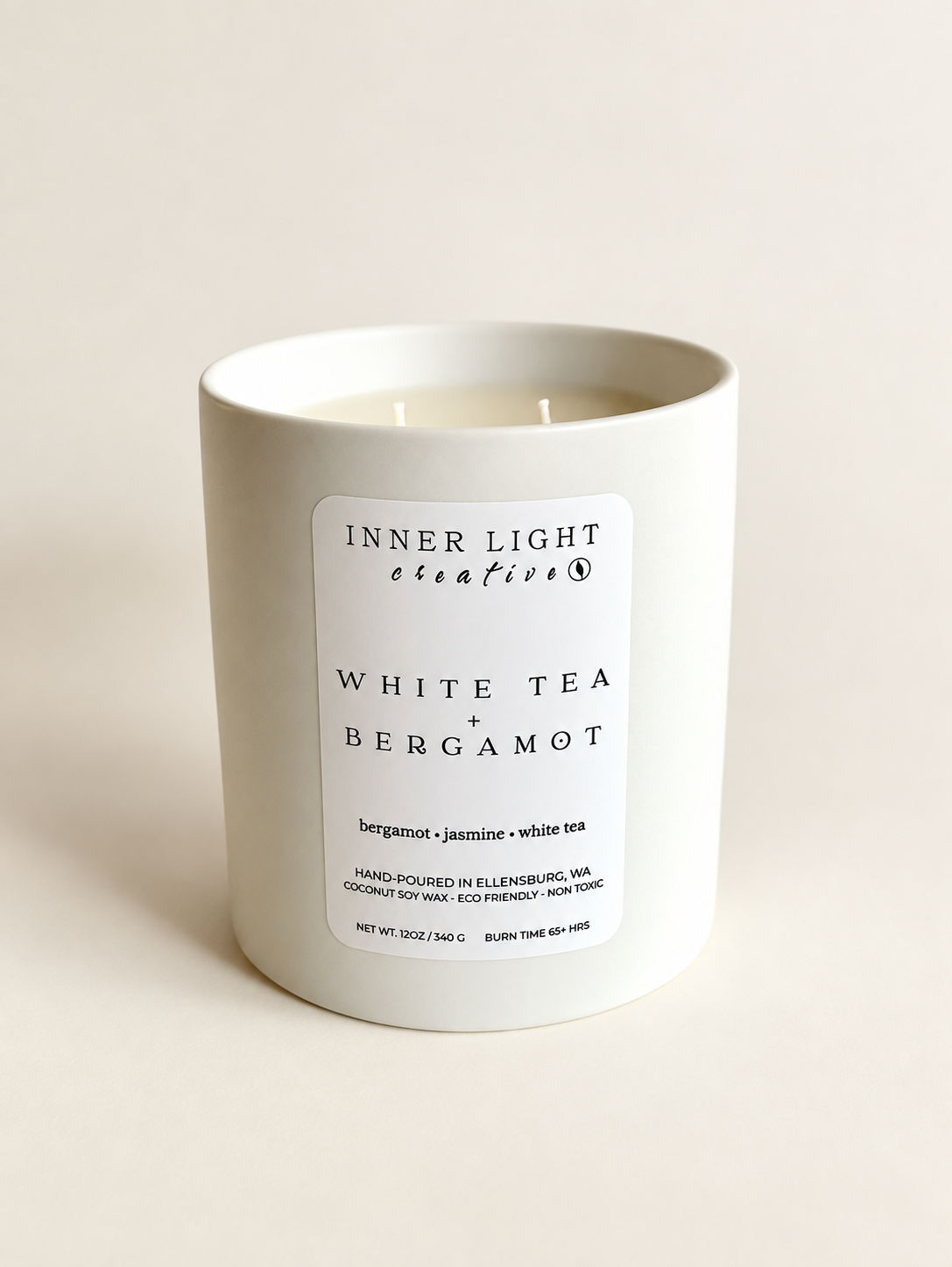 White Tea + Bergamot 12 oz double-wick coconut soy candle in a white ceramic vessel, hand-poured in Ellensburg, Washington